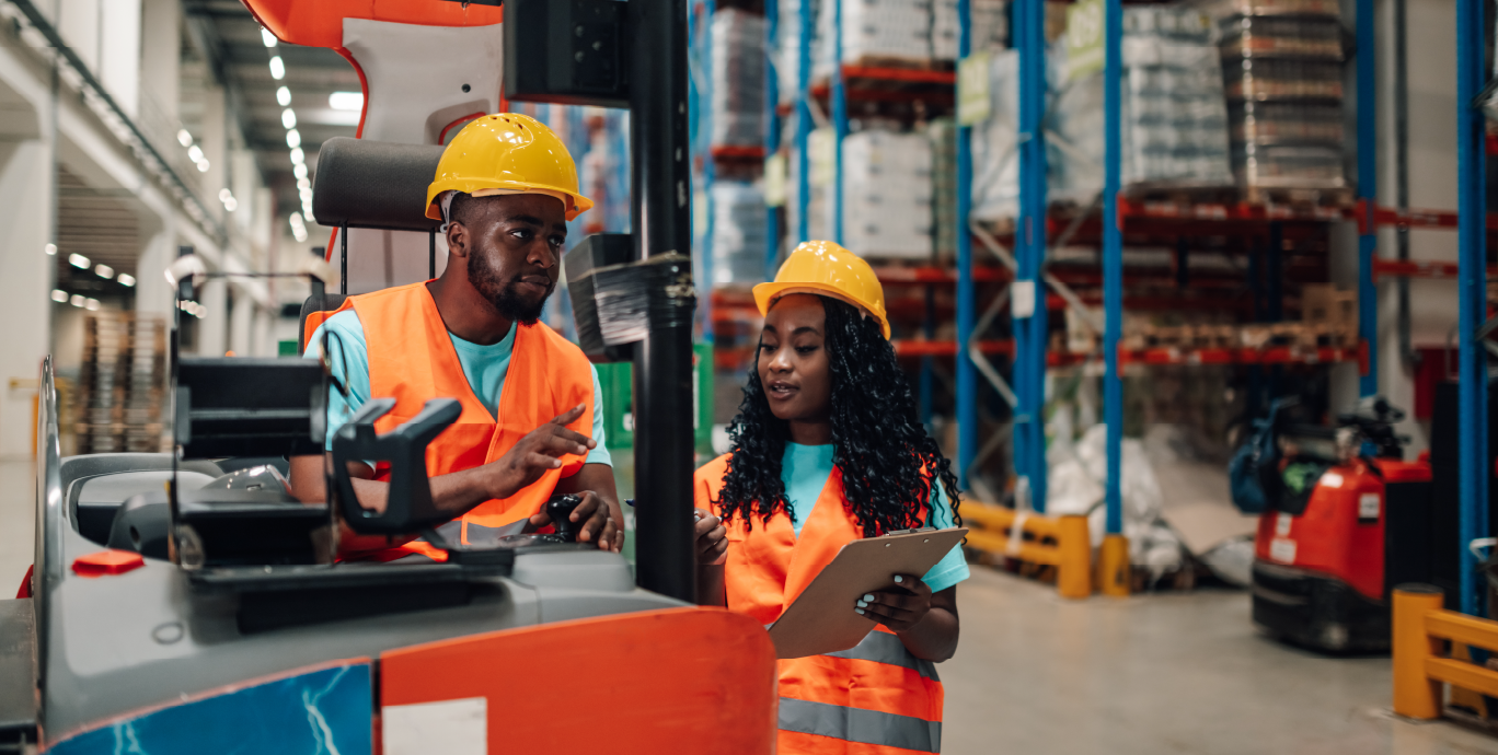 warehouse workers operating a forklift for palletized products
