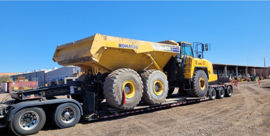 Dump truck on a freight trailer