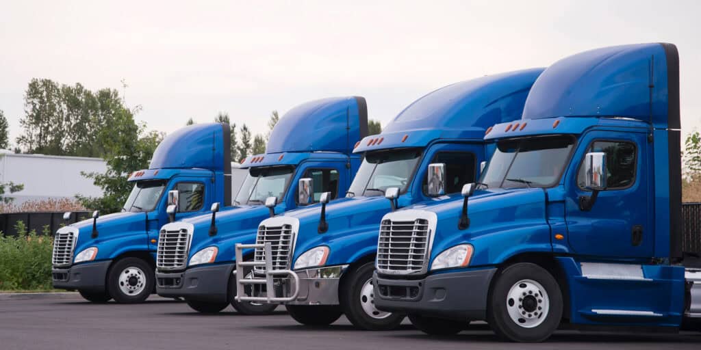 blue freight trucks parked
