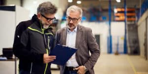 warehouse managers talking to each other